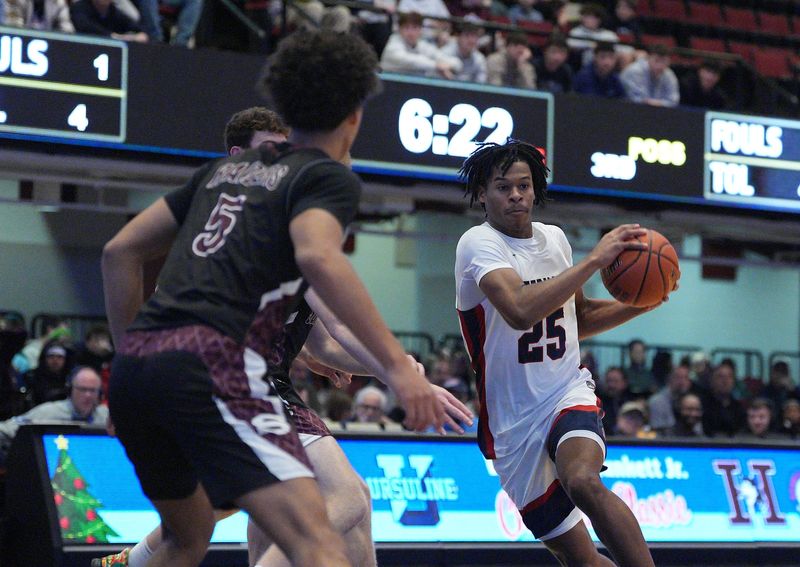 Stepinac's Jasiah Jervis (25) drives to the paint during the William F. Plunkett Jr. Christmas Classic against Scarsdale at Westchester County Center in White Plains on Saturday, December 21, 2024.