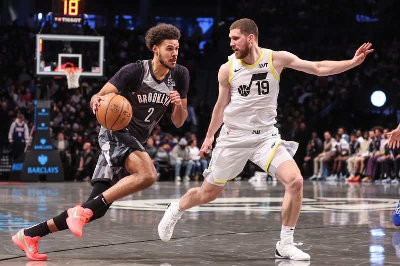 Dec 21, 2024; Brooklyn, New York, USA; Brooklyn Nets forward Cameron Johnson (2) controls the ball against Utah Jazz guard Svi Mykhailiuk (19) in the second quarter at Barclays Center. Mandatory Credit: Wendell Cruz-Imagn Images
