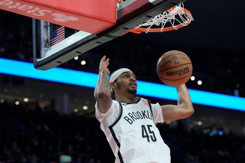 Jan 14, 2025; Portland, Oregon, USA; Brooklyn Nets guard Keon Johnson (45) dunks the ball during the first half against the Portland Trail Blazers at Moda Center. Mandatory Credit: Soobum Im-Imagn Images