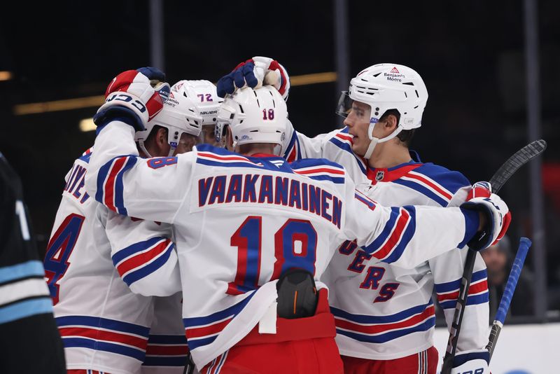 Jan 16, 2025; Salt Lake City, Utah, USA; The New York Rangers celebrate a goal by New York Rangers right wing Arthur Kaliyev (34) against the Utah Hockey Club during the first period at Delta Center. Mandatory Credit: Rob Gray-Imagn Images