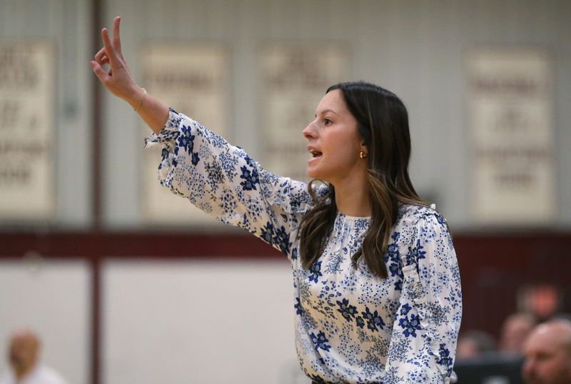 Webster Schroeder head coach Codi Mrozek calls in a defensive play during their Section V girls basketball matchup Thursday, Jan. 23, 2025 at Aquinas Institute.