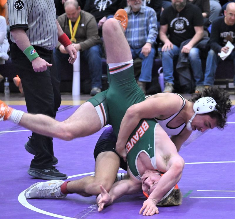 Little Falls Mountie Colton Wheet sends Beaver River's Dylan Buckingham tumbling to the mat during the 152-pound title bout at Section III's 2025 Class D wrestling tournament in Little Falls.
