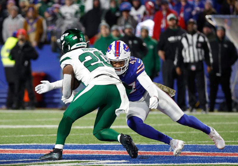 Buffalo Bills cornerback Christian Benford (47) steps up to tackle New York Jets running back Breece Hall (20).