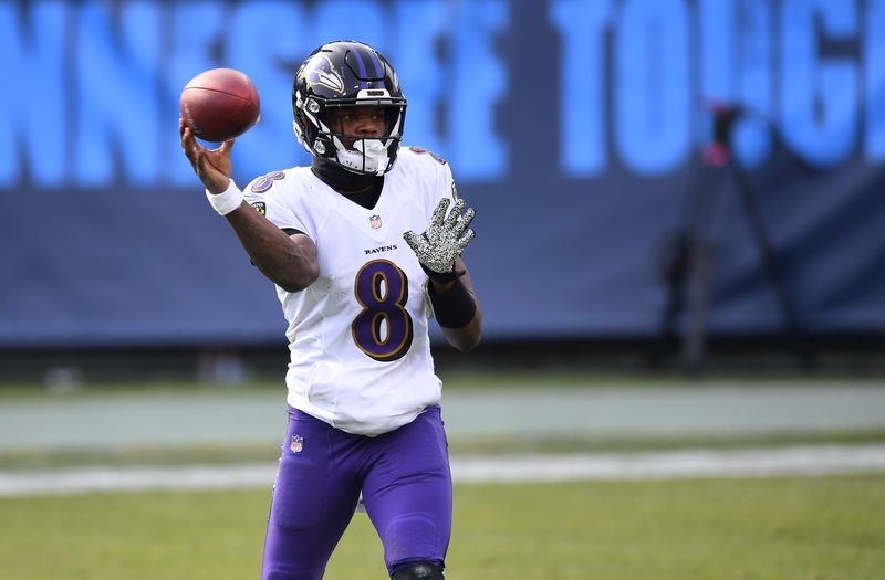 Jan 10, 2021; Nashville, Tennessee, USA; Baltimore Ravens quarterback Lamar Jackson (8) throws a pass against the Tennessee Titans during the third quarter in a AFC Wild Card playoff game at Nissan Stadium. Mandatory Credit: Christopher Hanewinckel-USA TODAY Sports