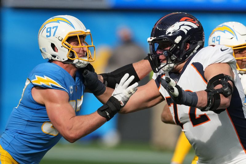 Jan 2, 2022; Inglewood, California, USA; Los Angeles Chargers defensive end Joey Bosa (97) attempts to get past Denver Broncos offensive tackle Garett Bolles (72) in the first half at SoFi Stadium. Mandatory Credit: Kirby Lee-USA TODAY Sports