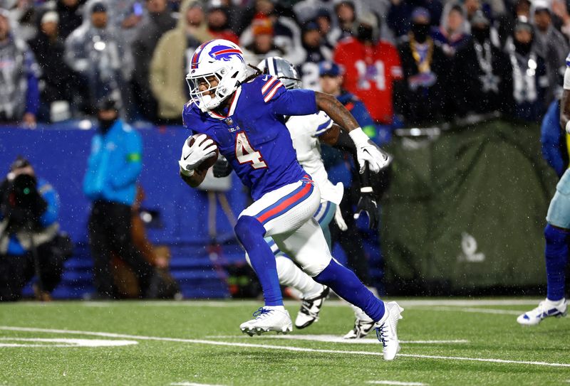 Buffalo Bills running back James Cook (4) heads for the end zone.