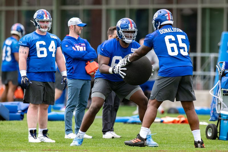 May 13, 2022; East Rutherford, NJ, USA; New York Giants offensive lineman Marcus McKethan (60) practices a drill during rookie camp at Quest Diagnostics Training Center. Mandatory Credit: John Jones-USA TODAY Sports