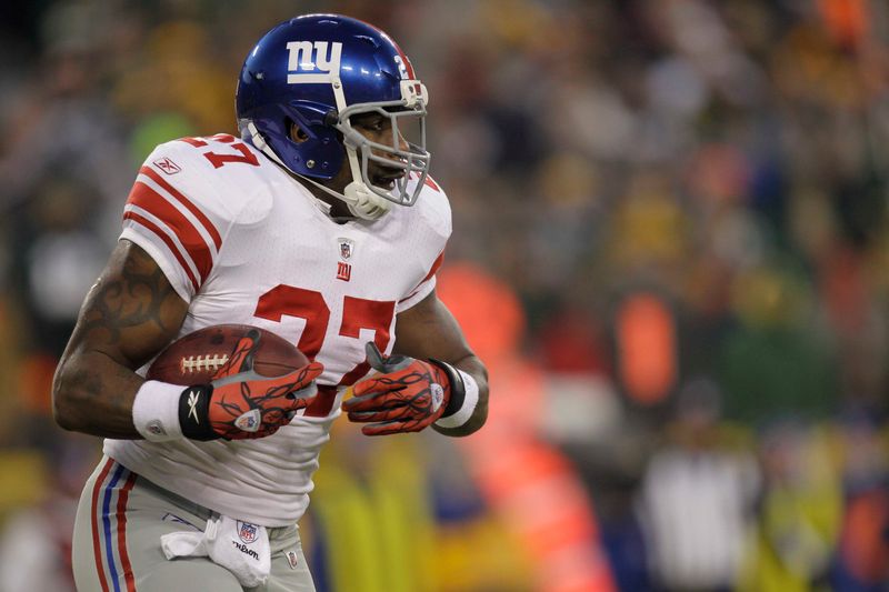 Jan 15, 2012; Green Bay, WI, USA; New York Giants running back Brandon Jacobs (27) rushes with the football during the NFC Divisional Playoff game against the Green Bay Packers at Lambeau Field. Mandatory Credit: Jeff Hanisch-USA TODAY Sports