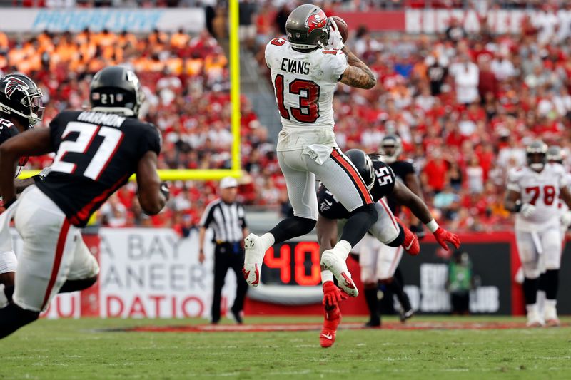 Sep 19, 2021; Tampa, Florida, USA; Tampa Bay Buccaneers wide receiver Mike Evans (13) catches the ball against the Atlanta Falcons during the second half at Raymond James Stadium. Mandatory Credit: Kim Klement-USA TODAY Sports