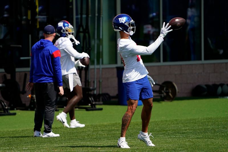 New York Giants wide receivers Isaiah Hodgins, right, and Parris Campbell participate in organized team activities (OTA's) at the Giants training center on Wednesday, May 31, 2023, in East Rutherford.