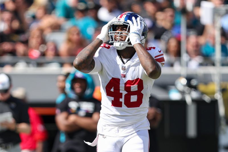 Oct 23, 2022; Jacksonville, Florida, USA; New York Giants linebacker Tae Crowder (48) reacts after a play against the Jacksonville Jaguars in the second quarter at TIAA Bank Field. Mandatory Credit: Nathan Ray Seebeck-USA TODAY Sports