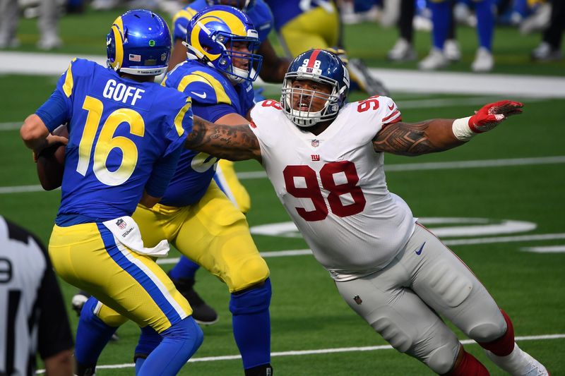 Oct 4, 2020; Inglewood, California, USA; New York Giants nose tackle Austin Johnson (98) closes in on Los Angeles Rams quarterback Jared Goff (16) in the fourth quarter at SoFi Stadium. Mandatory Credit: Robert Hanashiro-USA TODAY Sports