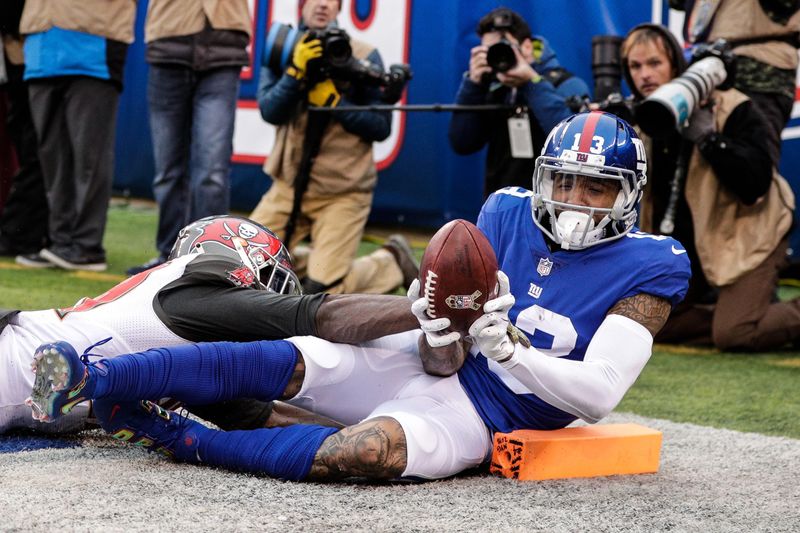 Nov 18, 2018; East Rutherford, NJ, USA; New York Giants wide receiver Odell Beckham (13) catches a touchdown pass while defended by Tampa Bay Buccaneers free safety Isaiah Johnson (39) during the second half at MetLife Stadium. Mandatory Credit: Vincent Carchietta-USA TODAY Sports