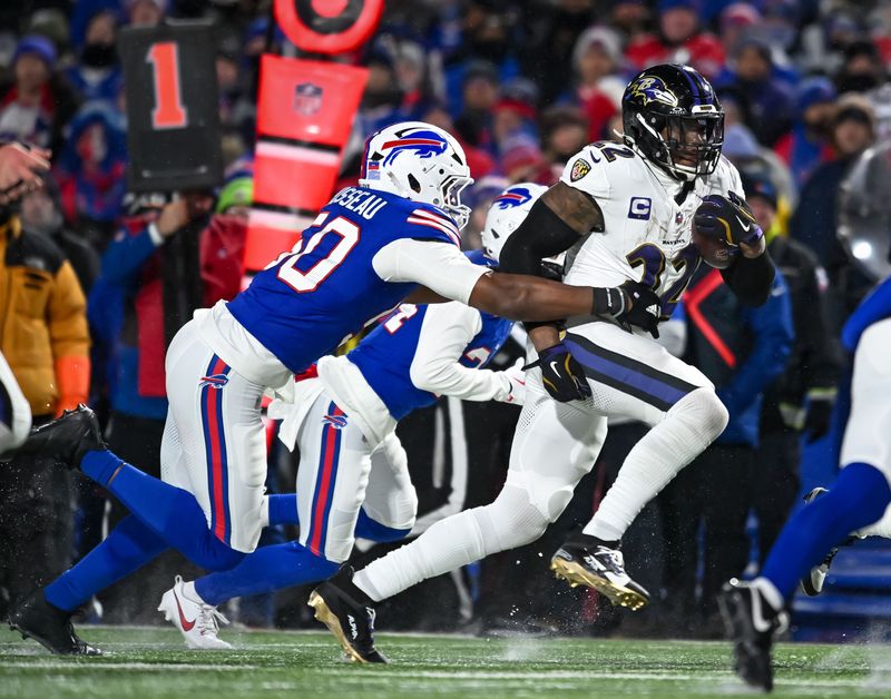 Jan 19, 2025; Orchard Park, New York, USA; Baltimore Ravens running back Derrick Henry (22) carries the ball as Buffalo Bills defensive end Greg Rousseau (50) attempts a tackle in the third quarter of a 2025 AFC divisional round game at Highmark Stadium. Mandatory Credit: Mark Konezny-Imagn Images