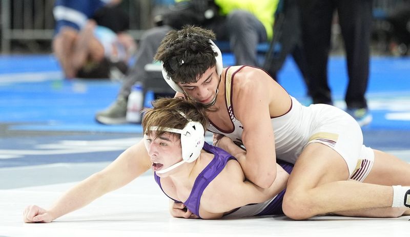 Iona Prep’s George Johnson wrestles Fairport’s Philly Provenzano in the 145-pound semifinal match at the NYSPHSAA Boys Wrestling Championships at MVP Arena in Albany on Saturday, March 1, 2025.