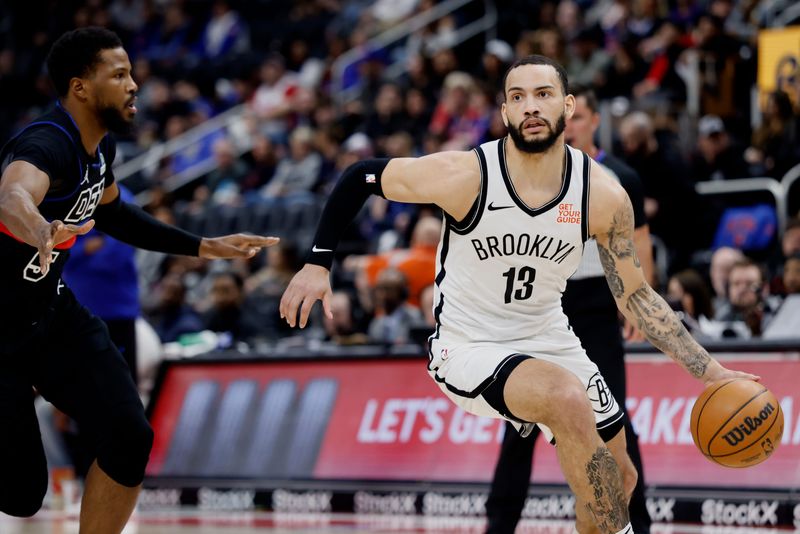 Mar 1, 2025; Detroit, Michigan, USA; Brooklyn Nets guard Tyrese Martin (13) dribbles against Detroit Pistons guard Malik Beasley (5) in the first half at Little Caesars Arena. Mandatory Credit: Rick Osentoski-Imagn Images