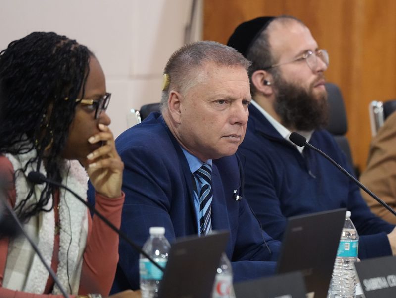 East Ramapo school board member Sabrina Charles-Pierre, left, Interim Supervisor Anthony DiCarlo and President Shimon Rose during a meeting of the board in Spring Valley March 4, 2025. Details of a surplus that could reach $100M at the end of the year was explained.