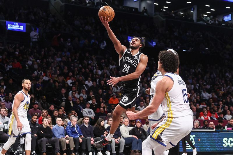 Mar 6, 2025; Brooklyn, New York, USA; Brooklyn Nets guard Cam Thomas (24) drives to the basket in the third quarter against the Golden State Warriors at Barclays Center. Mandatory Credit: Wendell Cruz-Imagn Images