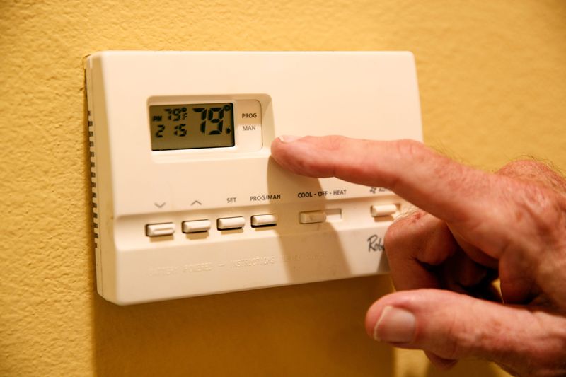 Thomas Hetmanek is on a fixed-income and has done a lot to reduce his electricity usage including setting his air conditioning thermostat to seventy-nine degrees. His energy bill is still way up this summer over last year. He is photographed in his Palm Springs, Calif., home on August 19, 2021.