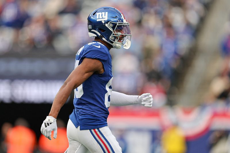 Dec 29, 2024; East Rutherford, New Jersey, USA; New York Giants wide receiver Darius Slayton (86) celebrates after scoring a touchdown reception during the first half against the Indianapolis Colts at MetLife Stadium. Mandatory Credit: Vincent Carchietta-Imagn Images