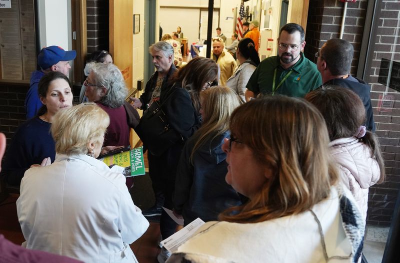 NYSEG customers wait to enter Carmel Town Hall where NYSEG representative were on hand to talk about customers bills March 13, 2025.