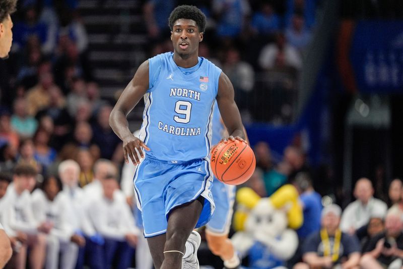 Mar 14, 2025; Charlotte, NC, USA; North Carolina Tar Heels guard Drake Powell (9) during the first half against the Duke Blue Devils at Spectrum Center. Mandatory Credit: Jim Dedmon-Imagn Images