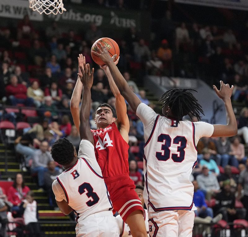 Tappan Zee's Billy Alexiou (44) is tied up ny Binghamton's Derek Abu Jr. (3) and Shawn Remplet (33) during the NYSPHSAA Class AA state final boys basketballl game at Visions Veterans Memorial Arena in Binghamton on Thursday, March 20, 2025.