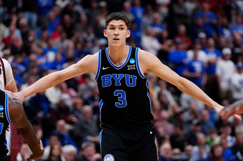 Mar 22, 2025; Denver, CO, USA; Brigham Young Cougars guard Egor Demin (3) reacts against the Wisconsin Badgers during the second half in the second round of the NCAA Tournament at Ball Arena. Mandatory Credit: Ron Chenoy-Imagn Images