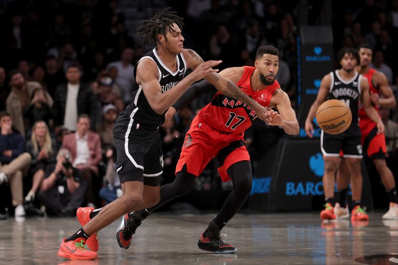 Apr 10, 2024; Brooklyn, New York, USA; Toronto Raptors forward Garrett Temple (17) steals the ball from Brooklyn Nets forward Noah Clowney (21) during the fourth quarter at Barclays Center. Mandatory Credit: Brad Penner-USA TODAY Sports