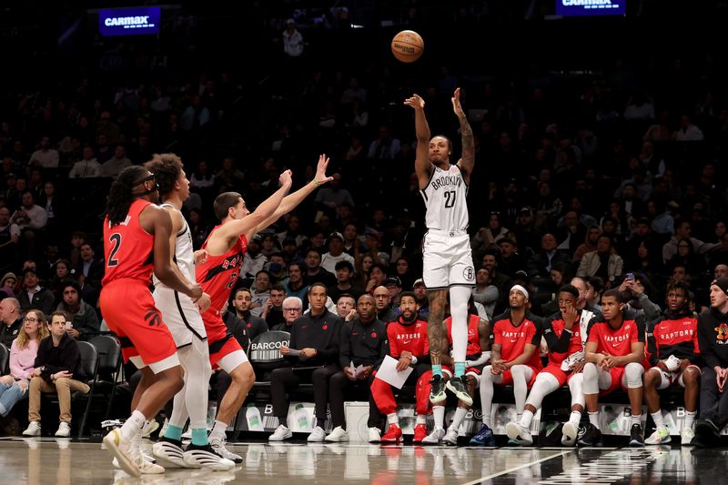 Mar 26, 2025; Brooklyn, New York, USA; Brooklyn Nets forward Maxwell Lewis (27) shoots a three point shot against Toronto Raptors forward Cole Swider (12) during the first quarter at Barclays Center. Mandatory Credit: Brad Penner-Imagn Images