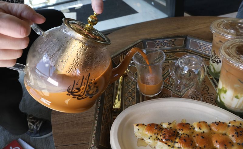 Pouring some Adeni Tea at the new Layali Coffee House on Jefferson Road in Henrietta Tuesday, April 22, 2025.