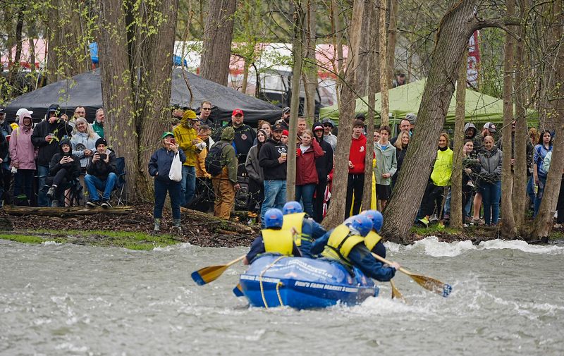 People lined Canandaigua Outlet banks a few rows deep to watch boaters in the Wild Water Derby in Shortsville on April 26, 2025.