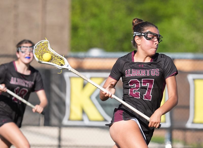 Albertus' Alexis Diaz (27) makes her way to the shooting zone during their 20-14 win over Nanuet in girls lacrosse at Nanuet High School on Wednesday, April 30, 2025.