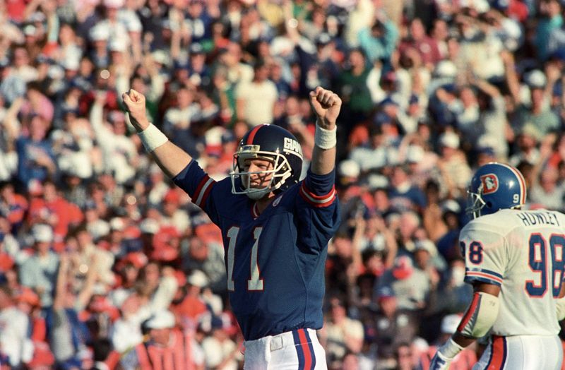 Jan 25, 1987; Pasadena, CA, USA; FILE PHOTO; New York Giants quarterback Phil Simms (11) reacts on the field against the Denver Broncos during Super Bowl XXI at the Rose Bowl. The Giants defeated the Broncos 39-20. Mandatory Credit: Bob Deutsch-USA TODAY Sports