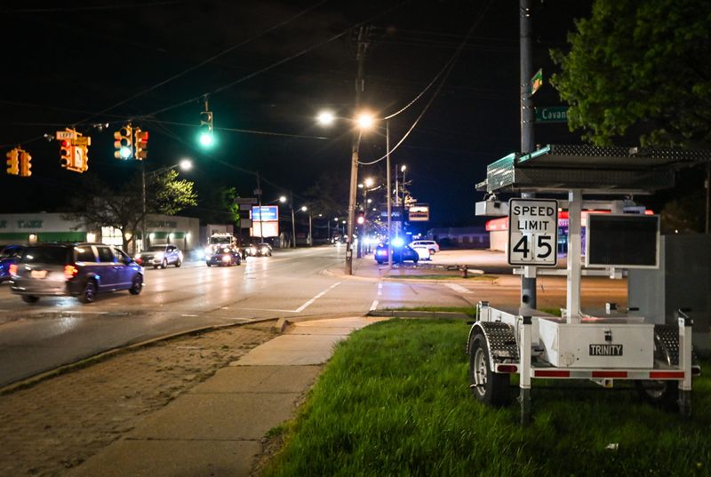 Lansing police pull over a vehicle late Friday evening, May 2, 2025, near South Martin Luther King Jr. Boulevard and East Cavanaugh Road in Lansing. The officer said the car was pulled over for reckless driving. It is not known if a ticket was issued.