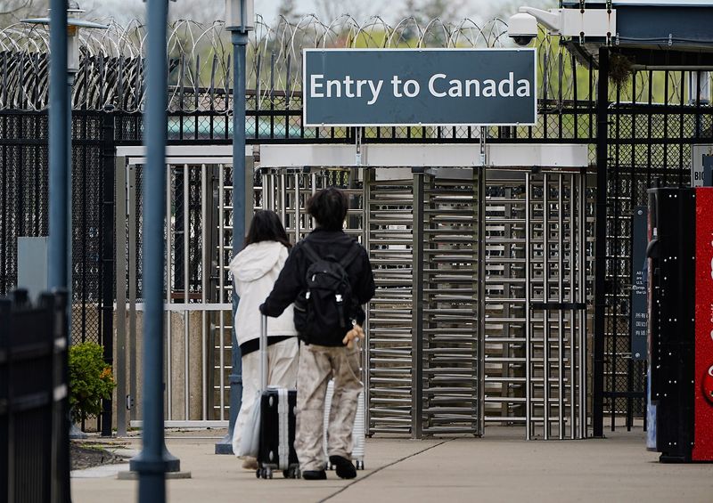 A couple heads to the pedestrian entrance to Canada at Niagara Falls State Park in Niagara Falls, NY on May 6, 2025.