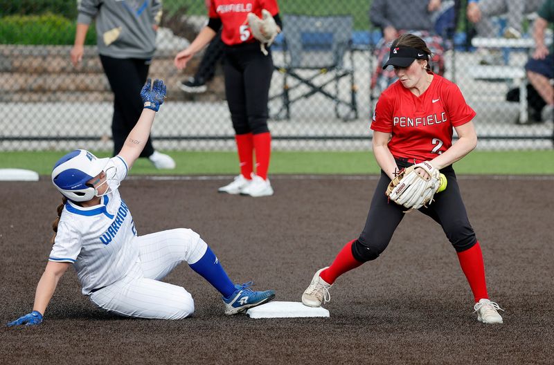 Schroeder’s Liana DeValder is called out on this force play by Penfield shortstop Stephanie Coughlin.