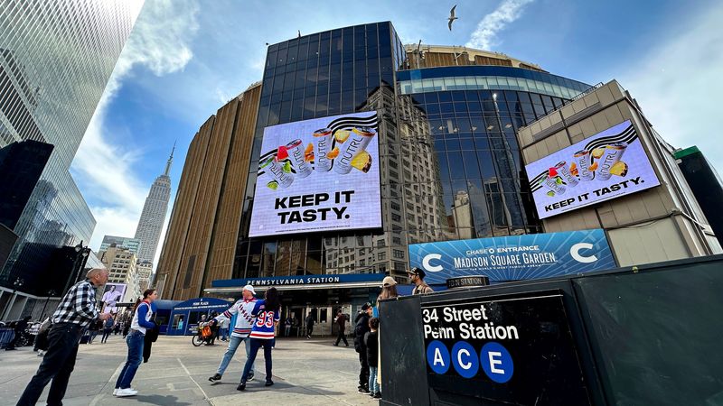 Fans walk into Madison Square Garden with a view of the Empire State Building and subway March 22, 2025, before a game between the Vancouver Canucks and New York Rangers.