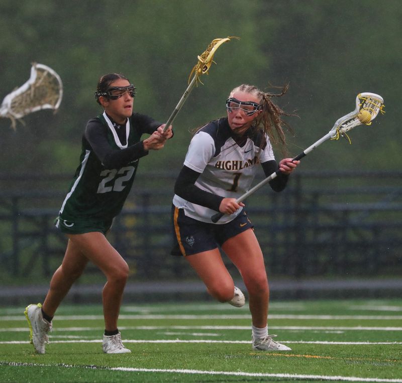 Quinn Ahrenholz of Highland (1) makes a play in the girls lacrosse game between Cornwall and Highland on May 9, 2025.