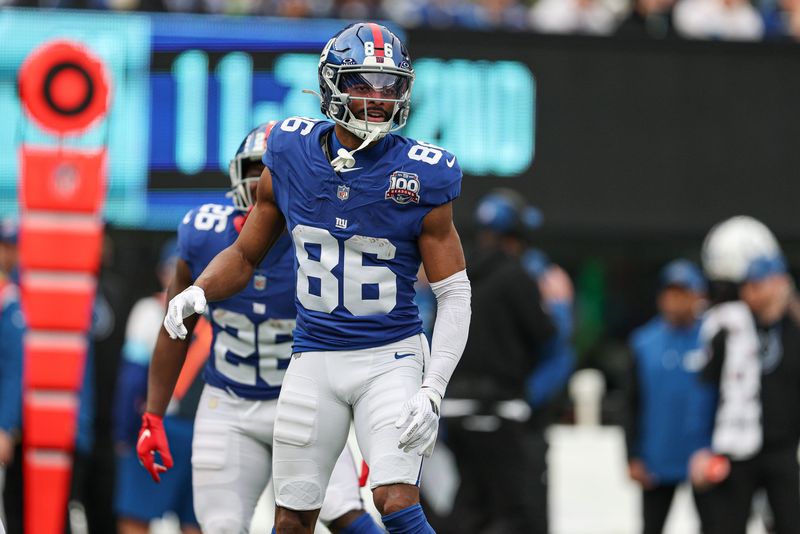 Dec 29, 2024; East Rutherford, New Jersey, USA; New York Giants wide receiver Darius Slayton (86) celebrates after scoring a touchdown reception during the first half against the Indianapolis Colts at MetLife Stadium. Mandatory Credit: Vincent Carchietta-Imagn Images