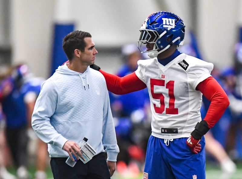 May 9, 2025; East Rutherford, NJ, USA; New York Giants general manager Joe Schoen and linebacker Abdul Carter (51) talk during rookie minicamp at Quest Diagnostics Training Center. Mandatory Credit: John Jones-Imagn Images
