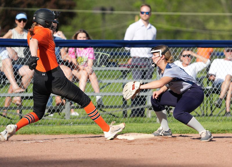Wellsville’s Kennedy Perry is called out on a play at third base last season.