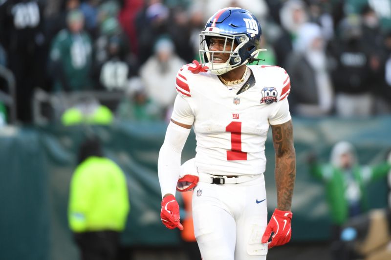 Jan 5, 2025; Philadelphia, Pennsylvania, USA; New York Giants wide receiver Malik Nabers (1) celebrates his 45-yard touchdown catch against the Philadelphia Eagles during the fourth quarter at Lincoln Financial Field. Mandatory Credit: Eric Hartline-Imagn Images