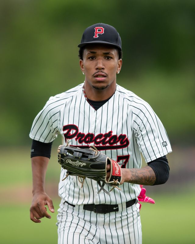Proctor's Radhames Emaniel Jr. jogs in from the outfield during  May 20 game at John F. Kennedy Middle School in Utica.