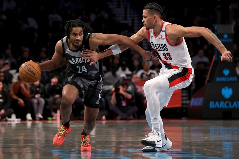 Feb 28, 2025; Brooklyn, New York, USA; Brooklyn Nets guard Cam Thomas (24) brings the ball up court against Portland Trail Blazers forward Toumani Camara (33) during the first quarter at Barclays Center. Mandatory Credit: Brad Penner-Imagn Images