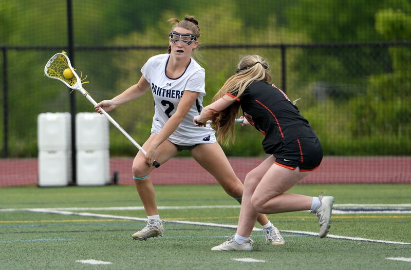Pittsford’s Sydney Bryant tries to beat Churchville-Chili defender Alaina Podszebka.