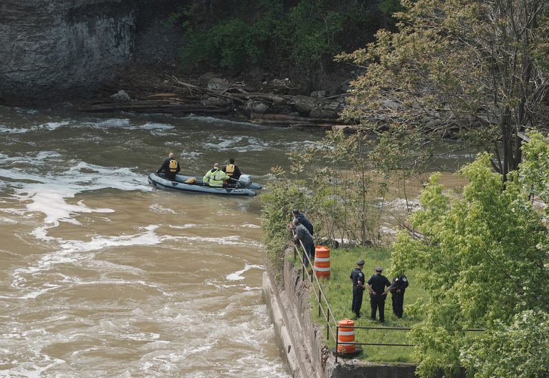 Rochester Police Scuba Team conintue the search for the 5-year-old boy fell into the Genesee River from the Andrew Street Bridge on June 1, 2025. The search on June 2, started in the surrounding area at the bottom of High Falls.