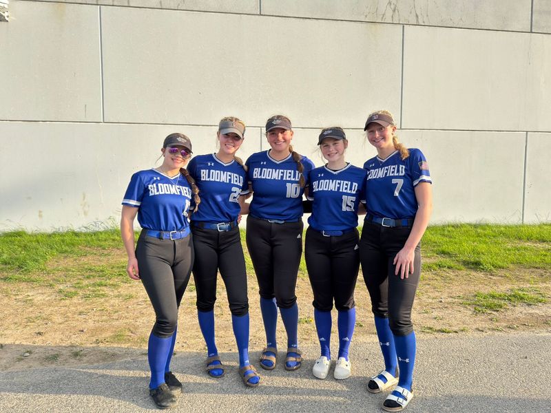 Bloomfield's Loghan Nowak (13), Ashlyn Wright (22), Brianna Leitten (10), Marlee Poole (15) and Calla McCombs after a 4-0 win over Bolivar-Richburg in the Section V Class C crossover Monday, June 2, 2025 at Livonia's Saunders Sports Complex. Wright threw a one-hitter.
