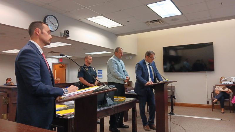 David Kingsley, right of center, stands before Judge Robert Bauer on June 3. He was back in court on July 15.