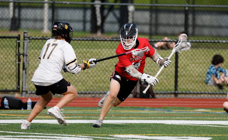 Penfield’s Brodie Joyce carries the ball around McQuaid’s Anthony Camarella.